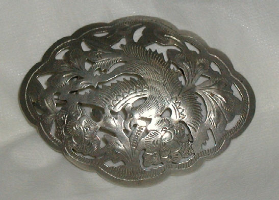 Peranakan silver buckle with bird design.