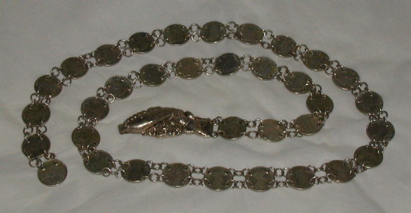 Peranakan silver coin belt with fish buckle.